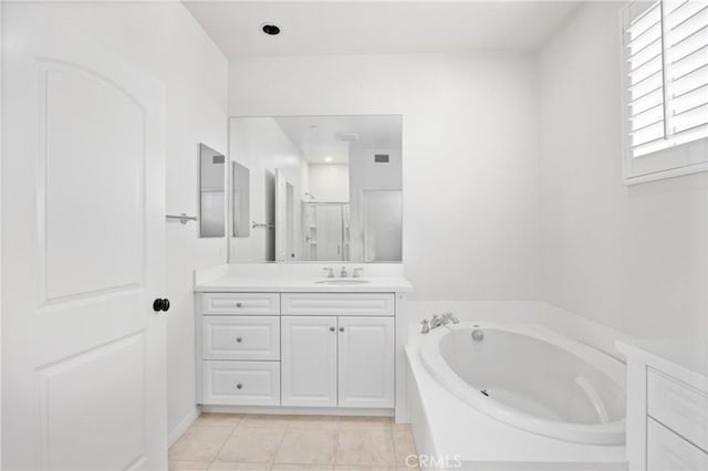 3240 S Westmont Ln Unit 5, Ontario, CA 91761 - full bathroom with vanity, a garden tub, and a stall shower