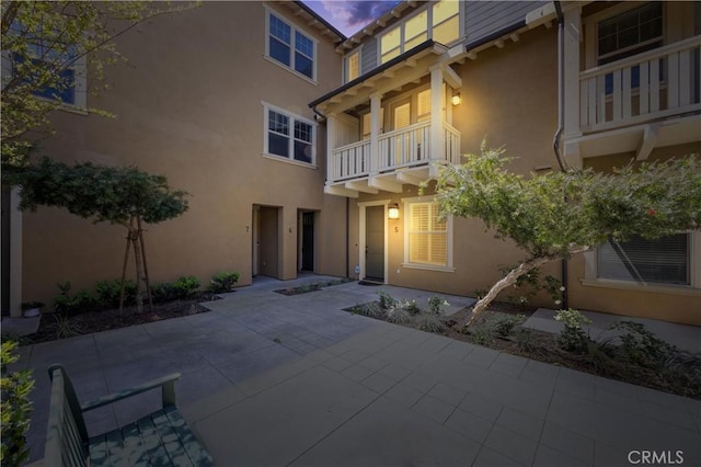 3240 S Westmont Ln Unit 5, Ontario, CA 91761 - exterior space featuring a patio area, stucco siding, and a balcony