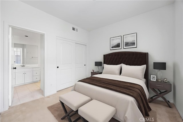 3240 S Westmont Ln Unit 5, Ontario, CA 91761 - bedroom featuring visible vents, light colored carpet, ensuite bath, and a closet