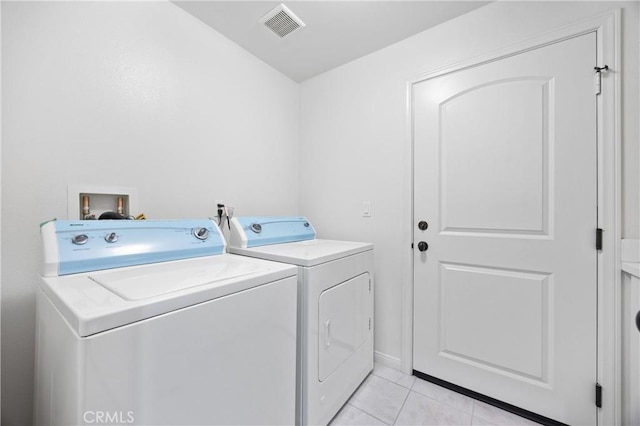 3240 S Westmont Ln Unit 5, Ontario, CA 91761 - laundry area featuring light tile patterned floors, visible vents, washing machine and clothes dryer, and laundry area
