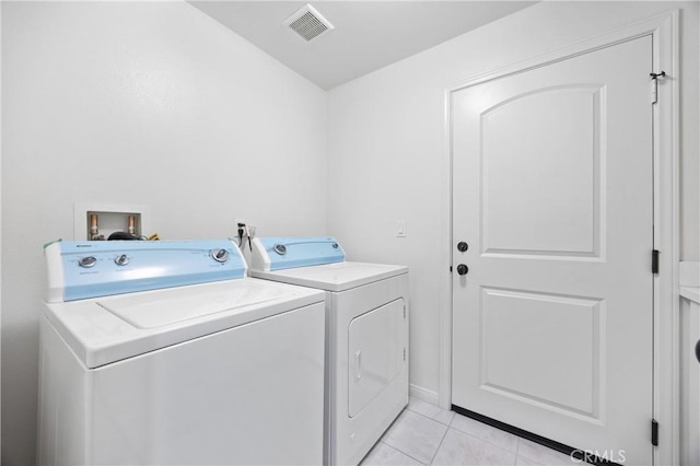 3240 S Westmont Ln Unit 5, Ontario, CA 91761 - laundry area with washer and clothes dryer and light tile patterned flooring
