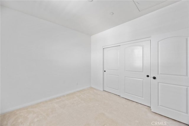 3240 S Westmont Ln Unit 5, Ontario, CA 91761 - unfurnished bedroom with light colored carpet, baseboards, and a closet
