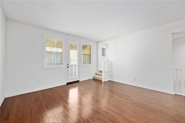 3240 S Westmont Ln Unit 5, Ontario, CA 91761 - spare room featuring stairs and wood finished floors
