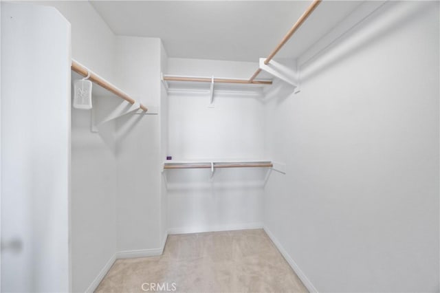 3240 S Westmont Ln Unit 5, Ontario, CA 91761 - walk in closet featuring carpet flooring