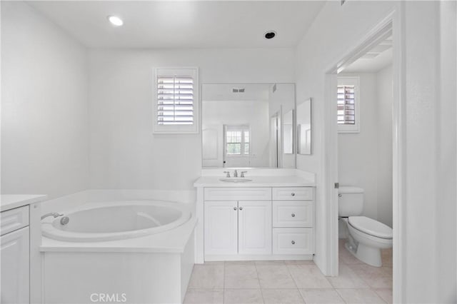 3240 S Westmont Ln Unit 5, Ontario, CA 91761 - bathroom with vanity, a garden tub, tile patterned flooring, and healthy amount of natural light