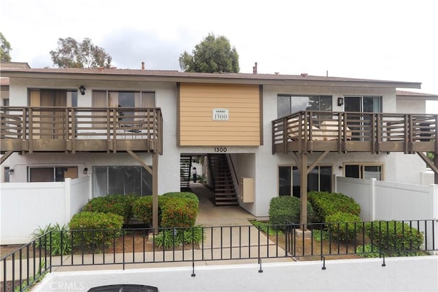 1310 W Lambert Rd Unit 180, La Habra, CA 90631 - view of property with fence and stairs