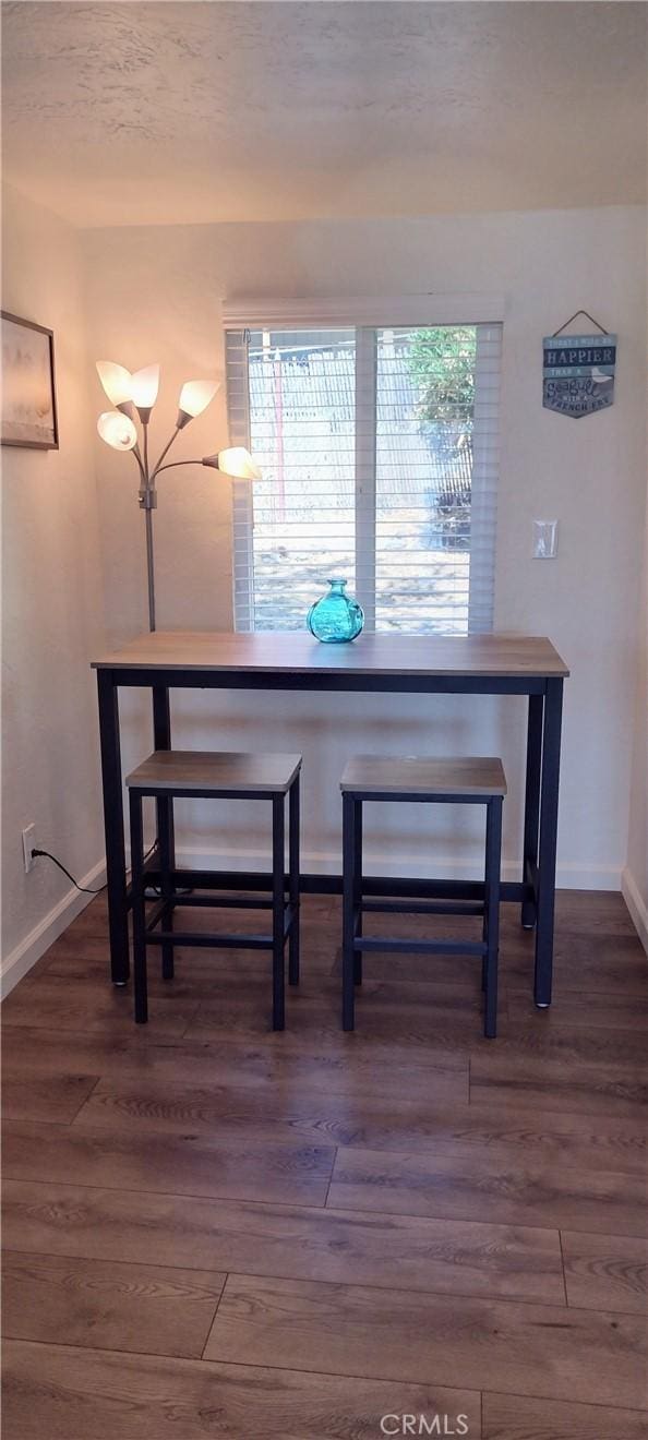dining room with wood finished floors and baseboards