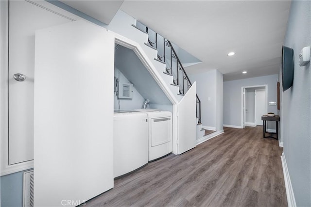 1880 Veteran Ave Unit 308, Los Angeles, CA 90025 - clothes washing area with recessed lighting, laundry area, washer and clothes dryer, wood finished floors, and baseboards