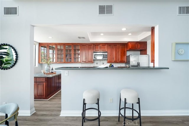 1880 Veteran Ave Unit 308, Los Angeles, CA 90025 - kitchen featuring stainless steel appliances, visible vents, and dark countertops
