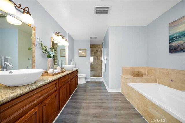 1880 Veteran Ave Unit 308, Los Angeles, CA 90025 - full bathroom featuring a shower stall, a garden tub, a sink, double vanity, and visible vents