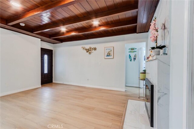 2315 Hillview Ave, Monterey Park, CA 91754 - entryway with wooden ceiling, light wood-style floors, beam ceiling, baseboards, and a fireplace