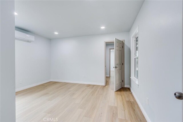 2315 Hillview Ave, Monterey Park, CA 91754 - empty room featuring a wall mounted air conditioner, light wood-style flooring, recessed lighting, and baseboards
