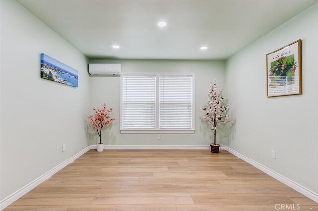 2315 Hillview Ave, Monterey Park, CA 91754 - spare room with a wall mounted air conditioner, light wood finished floors, recessed lighting, and baseboards