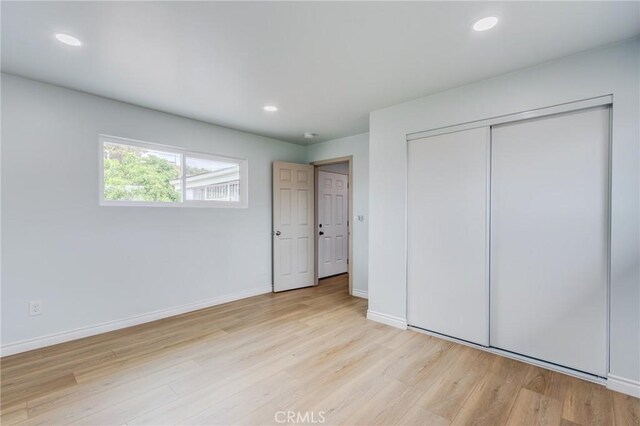 2315 Hillview Ave, Monterey Park, CA 91754 - unfurnished bedroom featuring wood finished floors, a closet, baseboards, and recessed lighting