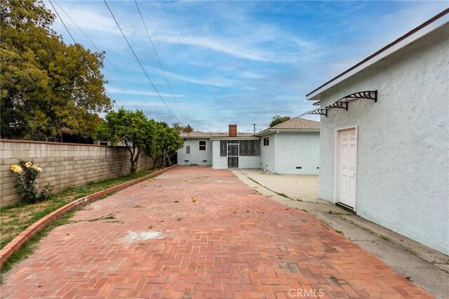 2315 Hillview Ave, Monterey Park, CA 91754 - rear view of property with stucco siding, fence, and a patio