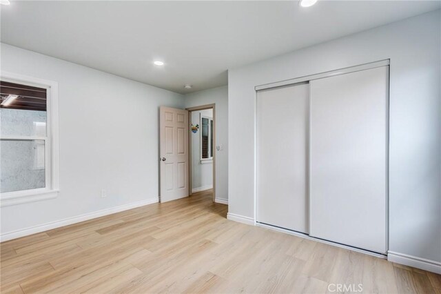2315 Hillview Ave, Monterey Park, CA 91754 - unfurnished bedroom featuring wood finished floors, a closet, baseboards, and recessed lighting