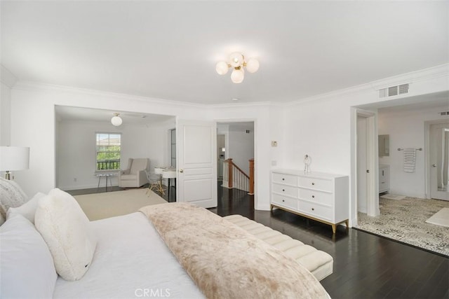 bedroom featuring visible vents, ornamental molding, electric panel, and dark wood-type flooring