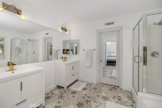 bathroom with visible vents, crown molding, plenty of natural light, and a shower stall