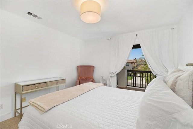 bedroom with access to outside and visible vents