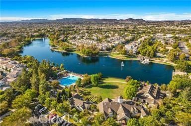 bird's eye view with a residential view and a water and mountain view