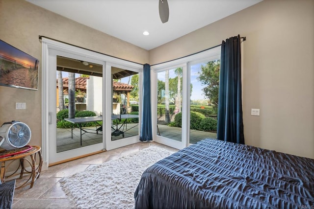 bedroom featuring a ceiling fan, stone tile flooring, access to outside, and recessed lighting