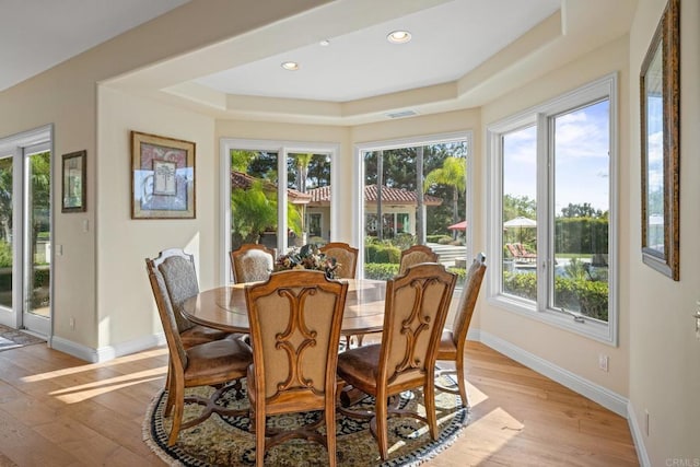 1072 Wiegand, Encinitas, CA 92024 - dining room featuring healthy amount of natural light, a tray ceiling, light wood-style floors, and recessed lighting
