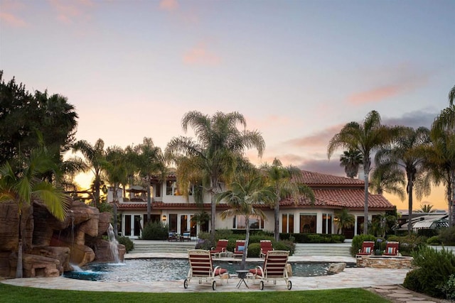 1072 Wiegand, Encinitas, CA 92024 - back of property featuring a tiled roof, an outdoor pool, and a patio area