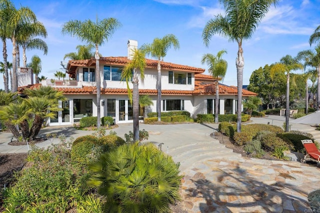 1072 Wiegand, Encinitas, CA 92024 - rear view of property with french doors, a tiled roof, a chimney, stucco siding, and a balcony