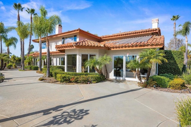 1072 Wiegand, Encinitas, CA 92024 - rear view of property featuring stucco siding and solar panels