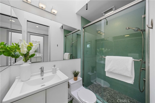 9 Temple Ave, Long Beach, CA 90803 - bathroom featuring toilet, vanity, and a stall shower