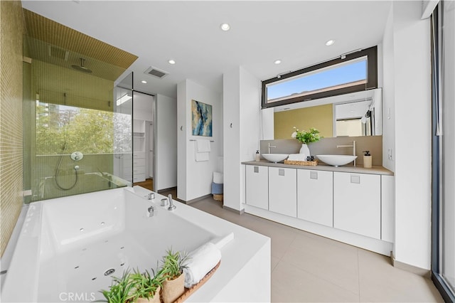9 Temple Ave, Long Beach, CA 90803 - bathroom featuring a shower stall, a tub with jets, a sink, double vanity, and baseboards