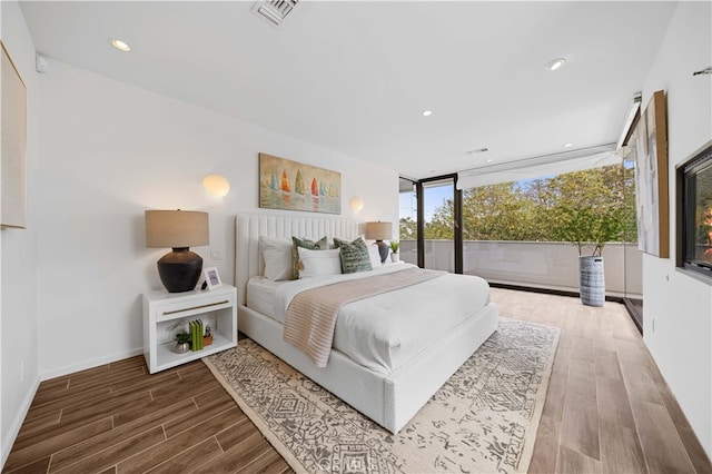 9 Temple Ave, Long Beach, CA 90803 - bedroom with baseboards, wood finished floors, visible vents, and recessed lighting