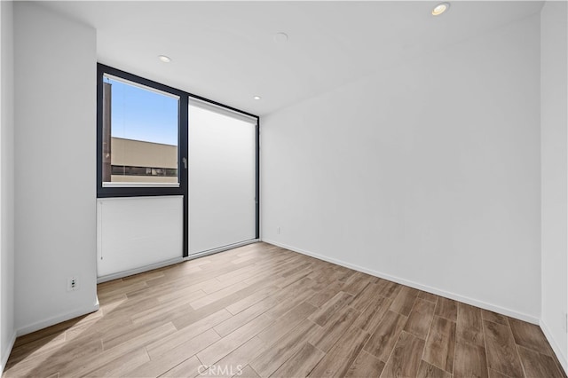 9 Temple Ave, Long Beach, CA 90803 - spare room featuring recessed lighting, wood finished floors, and baseboards