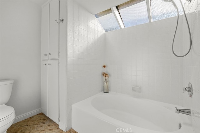 bathroom with toilet and baseboards