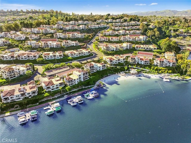 drone / aerial view with a water and mountain view