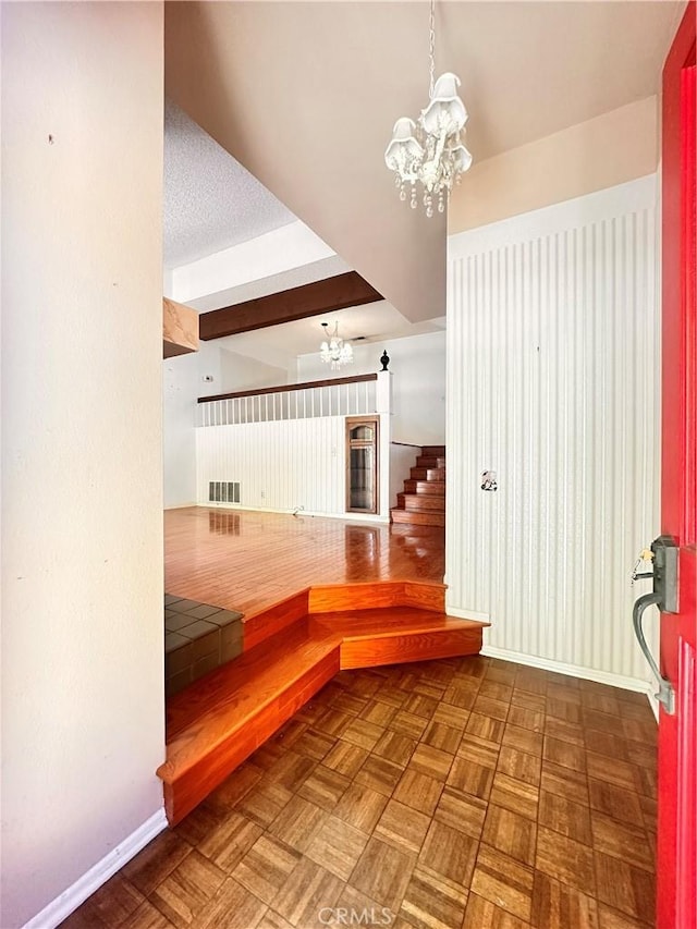 7 Wilderness Pl, Pomona, CA 91766 - stairs with a chandelier and baseboards