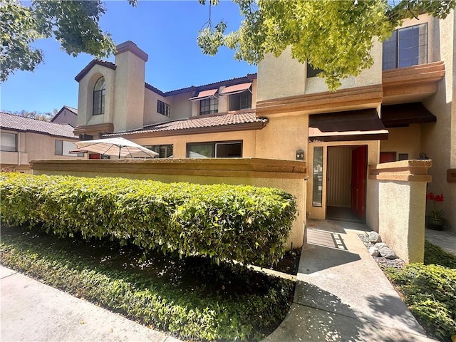 7 Wilderness Pl, Pomona, CA 91766 - view of front of property featuring stucco siding and a tiled roof