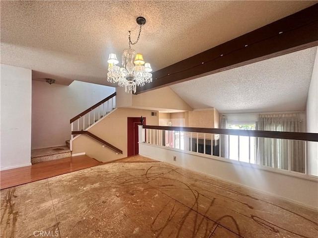 7 Wilderness Pl, Pomona, CA 91766 - unfurnished living room featuring a textured ceiling and a chandelier