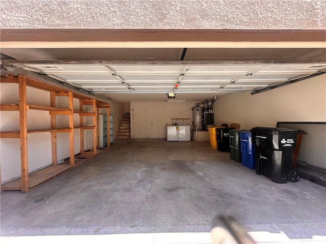 7 Wilderness Pl, Pomona, CA 91766 - garage featuring gas water heater, washing machine and dryer, and a garage door opener
