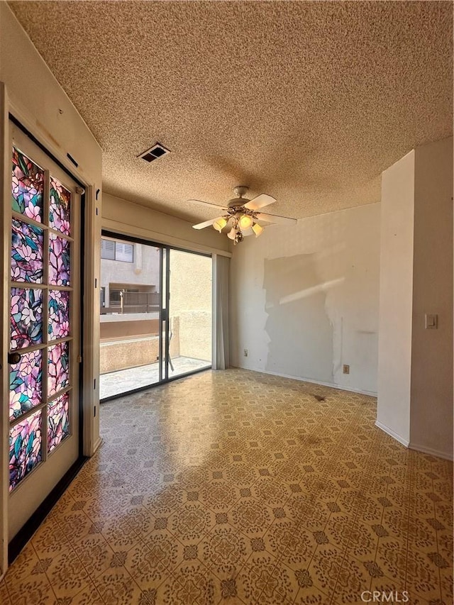 7 Wilderness Pl, Pomona, CA 91766 - spare room with a textured ceiling and a ceiling fan