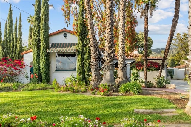 919 W Kenneth Rd, Glendale, CA 91202 - view of front of property with fence, a front yard, and stucco siding