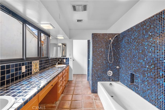 919 W Kenneth Rd, Glendale, CA 91202 - full bath with backsplash, double vanity, visible vents, and shower / washtub combination