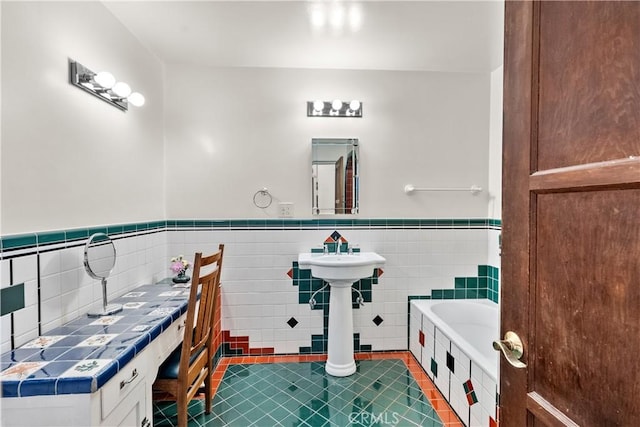 919 W Kenneth Rd, Glendale, CA 91202 - full bath featuring a wainscoted wall, tile patterned floors, a relaxing tiled tub, and tile walls