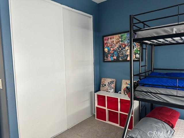 1380 Riverstone Ct, Hemet, CA 92545 - bedroom with carpet floors and a closet