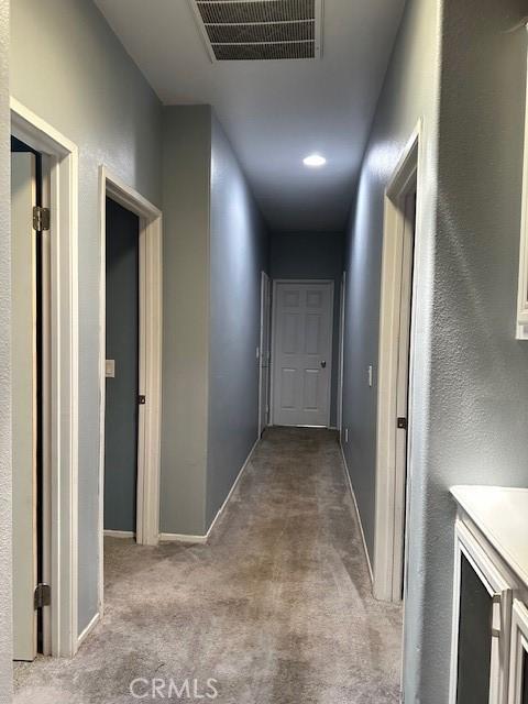 1380 Riverstone Ct, Hemet, CA 92545 - corridor with baseboards, visible vents, and carpet flooring