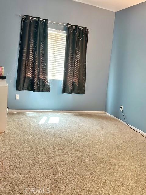 1380 Riverstone Ct, Hemet, CA 92545 - empty room with baseboards and carpet floors