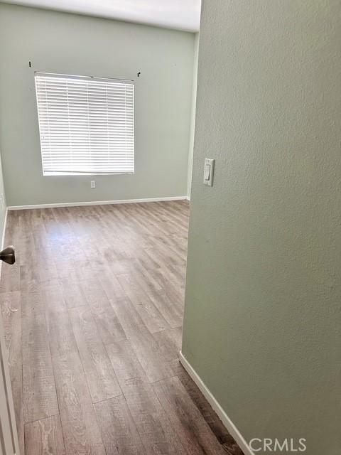 1380 Riverstone Ct, Hemet, CA 92545 - unfurnished room with wood finished floors and baseboards
