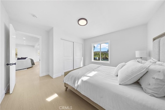 10321 Mcbroom St, Sunland, CA 91040 - bedroom featuring light wood-style flooring, a closet, and baseboards
