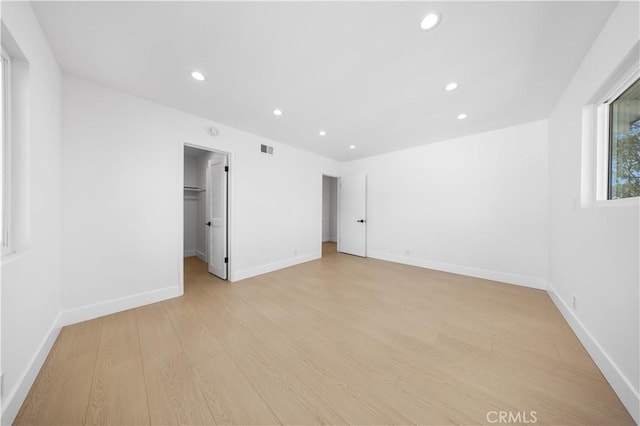 10321 Mcbroom St, Sunland, CA 91040 - unfurnished bedroom with baseboards, a spacious closet, visible vents, recessed lighting, and light wood-style floors