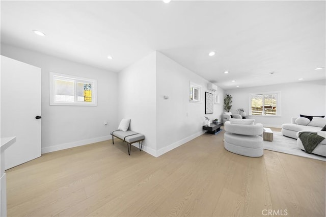 10321 Mcbroom St, Sunland, CA 91040 - living room featuring light wood finished floors, baseboards, recessed lighting, and a wall unit AC